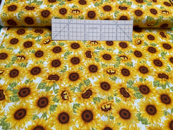 100 percent cotton fabric beautiful sunflowers. Quantity 1= fat quarter. Greater than 1 is a continuous cut.