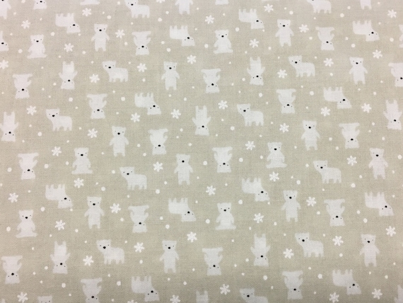 100 percent cotton fabric polar bears on a light beige background. Quantity 1= fat quarter. Greater than 1 is a continuous cut.