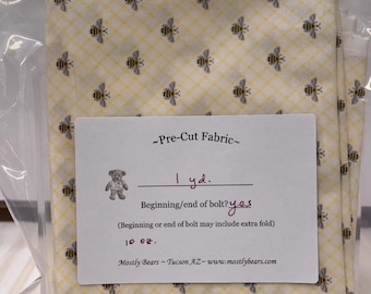 A 1-yard precut of 100% cotton fabric, bees on yellow.
