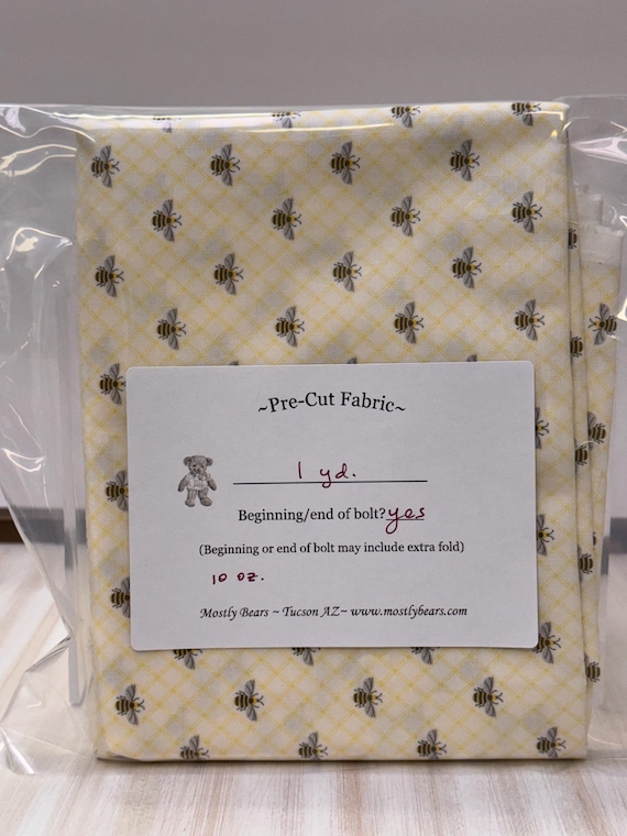 A 1-yard precut of 100% cotton fabric, bees on yellow.
