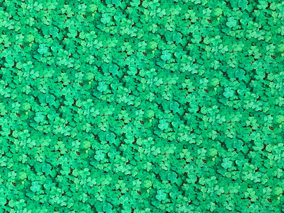 100 percent cotton fabric shamrocks. Quantity 1= fat quarter. Greater than 1 is a continuous cut.