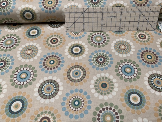 100 percent cotton fabric Beige with multicolor circles. Quantity 1= fat quarter. Greater than 1 is a continuous cut.
