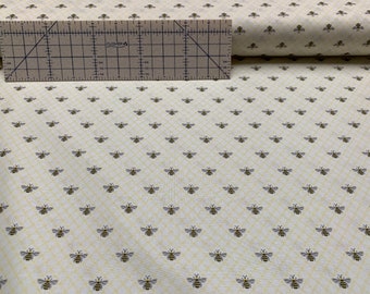 100 percent cotton fabric, bees on pale yellow. Quantity 1= fat quarter. Greater than 1 is a continuous cut. *See note about color!