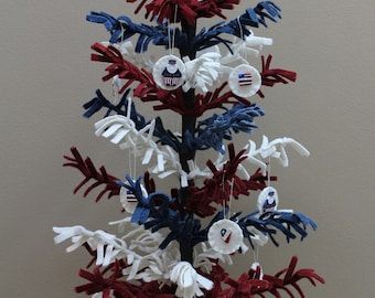 Pattern for wooly feather tree, includes polymer clay buttons & wooden base. Free 1/2 yard of craft felt with purchase.
