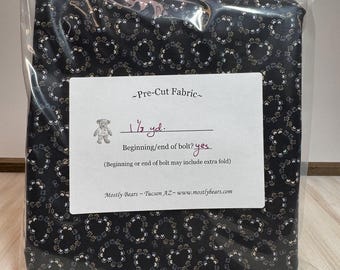 A single 1-1/3 yard precut of 100 percent cotton fabric, hearts and paw prints.