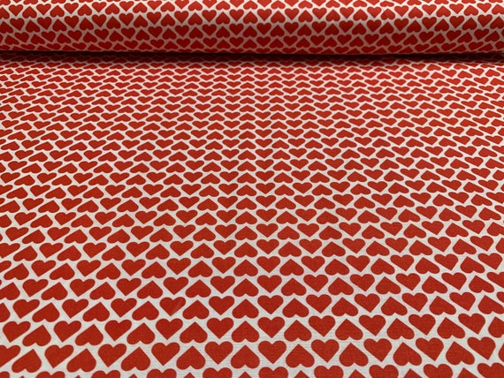 100 percent cotton fabric with red hearts all over. Quantity 1= fat quarter. Greater than 1 is a continuous cut.