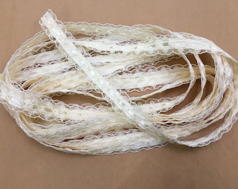 We have a large cone of vintage-like lacey ribbon... cream color, retro!