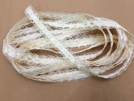 We have a large cone of vintage-like lacey ribbon... cream color, retro!