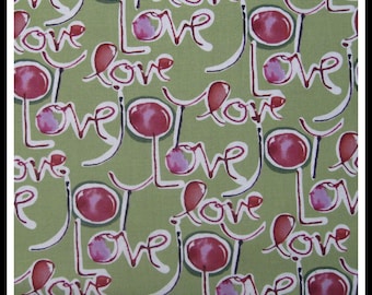 100 percent cotton fabric Love, sage green background. Quantity 1= fat quarter. Greater than 1 is a continuous cut.