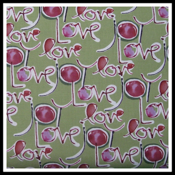 100 percent cotton fabric Love, sage green background. Quantity 1= fat quarter. Greater than 1 is a continuous cut.