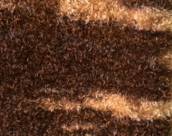 A variegated mohair fabric, curly, matted, one half yard.