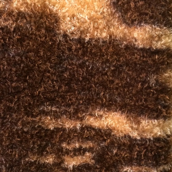 A variegated mohair fabric, curly, matted, one half yard.