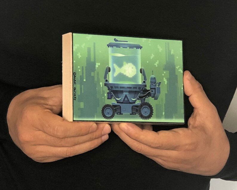 May include: A green and blue pixelated illustration of a robot carrying a fish tank with a single fish inside. The robot is on a green background with pixelated buildings in the background. The text "&copy;ALAN QUIR&Oacute;S" is on the side of the image.