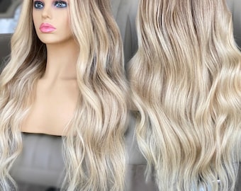 May include: A long, wavy blonde wig with highlights. The wig is styled with loose waves and has a natural-looking hairline.