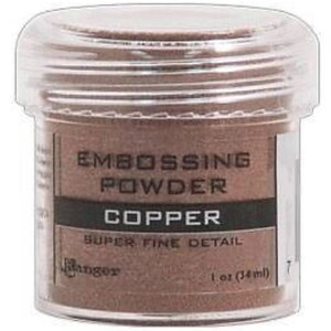 May include: A small clear jar of copper embossing powder. The label reads "Embossing Powder, Copper, Super Fine Detail, Ranger, 1 oz (34 ml)"