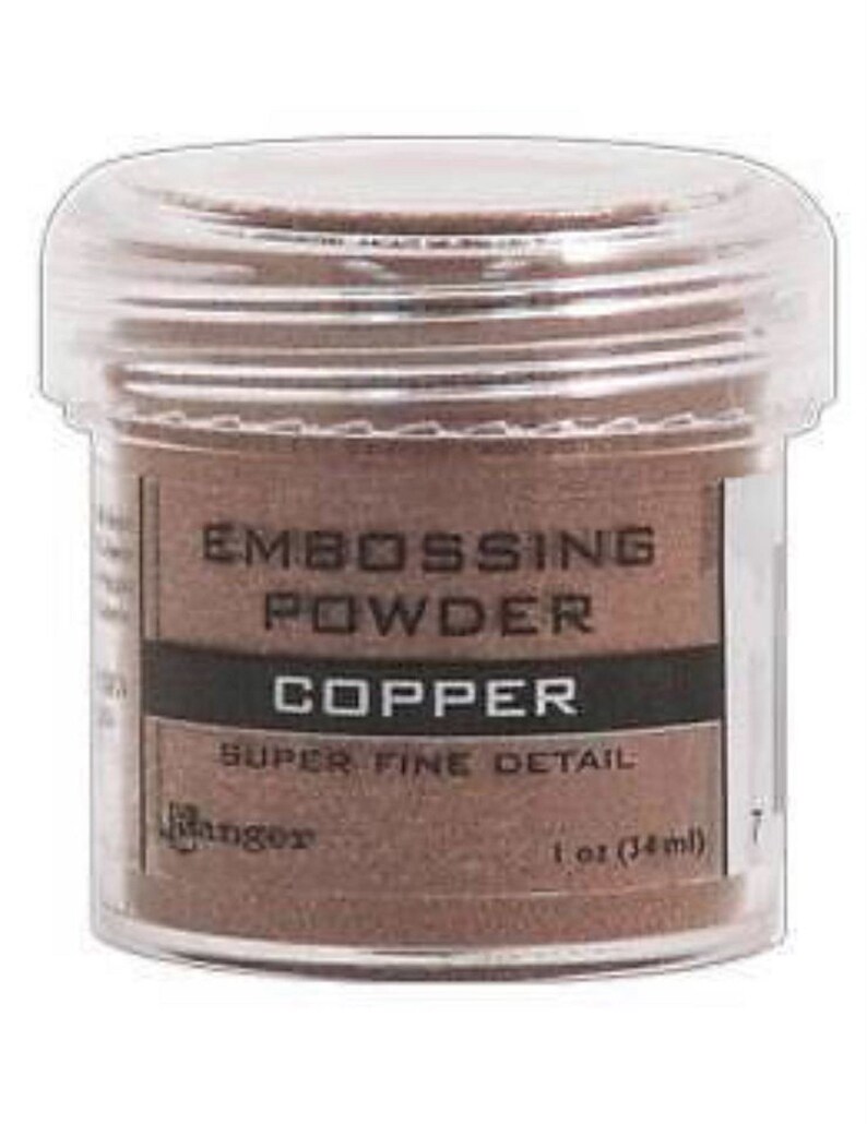 May include: A small clear jar of copper embossing powder. The label reads "Embossing Powder, Copper, Super Fine Detail, Ranger, 1 oz (34 ml)"