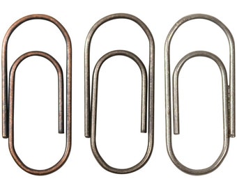 Peut inclure: Trois trombones en métal dans différentes finitions : cuivre, argent et gris foncé.
