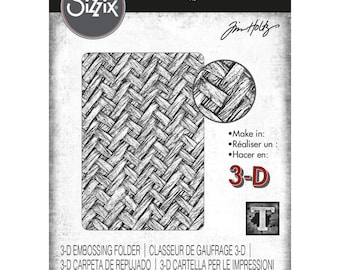 May include: A black and white image of a 3-D embossing folder with a woven pattern. The folder is labeled "3-D Texture Fades" and "Sizzix".