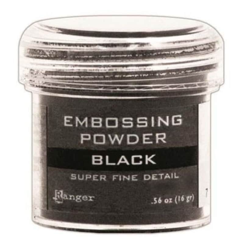 May include: A small, clear plastic jar of black embossing powder. The label reads "Embossing Powder Black Super Fine Detail Ranger .56 oz (16 gr)"