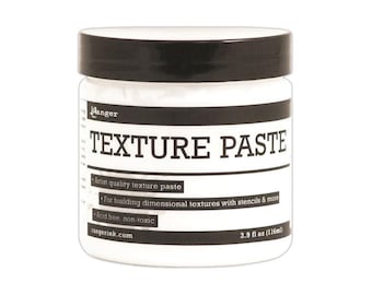May include: A white plastic jar with a black screw-on lid containing texture paste. The label features the text Ranger, TEXTURE PASTE, Artist quality texture paste, For building dimensional textures with stencils & more, Acid free, non-toxic, rangerink.com, and 3.9 fl oz (116ml).