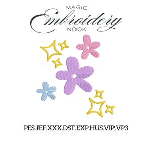 May include: An embroidered design featuring a collection of colorful flowers and starbursts. The design includes a large lavender flower, a pink flower, a light blue flower, and several yellow starbursts. The text "MAGIC Embroidery Nook" is at the top.