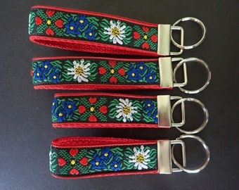 EDELWEISS Key Fob. Jacquard fob red, white, blue, green on black. Red webbing. Silver nickel hardware. Wristlet. 1" wide, Size, style choice