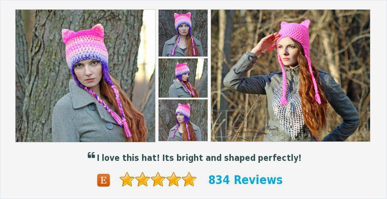 May include: A pink and purple crocheted cat ear hat with long, braided ties. The hat is worn by a person with long, red hair. The hat is shown in multiple angles.