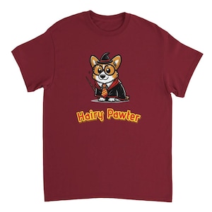 May include: A maroon t-shirt with a cartoon image of a corgi wearing a wizard hat and holding a wand. The text "Hairy Pawter" is printed in yellow below the image.