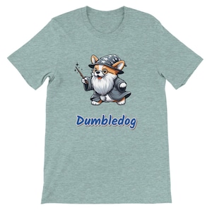May include: A light blue t-shirt with a cartoon image of a corgi wearing a wizard hat and holding a wand. The text "Dumbledog" is printed in blue below the image.