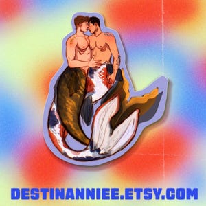 May include: A sticker featuring two shirtless mermen kissing, with koi fish tails in shades of brown, white, and orange. The sticker has a purple outline and a colorful background. The text "DESTINANNIEE.ETSY.COM" is at the bottom.