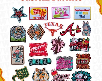 May include: A collection of colourful iron-on patches featuring various designs, including a marijuana leaf, a Texas flag, a baseball player, a slot machine, and a beer can. The patches are ideal for adding a personal touch to clothing, bags, or other accessories.