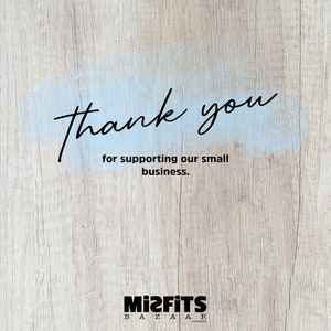 May include: Thank you for supporting our small business. Mizfits Bazaar company logo on a woodgrain background.