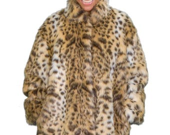 May include: A brown and white leopard print faux fur coat with a high collar and a button closure.