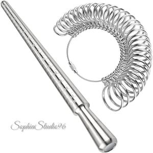 May include: A silver ring sizer mandrel with measurements and a set of silver ring sizer gauges. The mandrel is conical with numbered markings. The ring sizer gauges are attached to a silver cable.