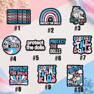 May include: A collection of ten stickers featuring the text Protect the Dolls or Protect Trans Kids in various fonts and designs, utilizing a color palette of pink, white, and blue. The stickers include graphic elements like rainbows, a dinosaur, flowers, and smiley faces.