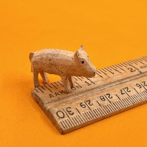 vintage miniature wood pig . plucky painted carved pig with a beautiful patina . tiny wood pig