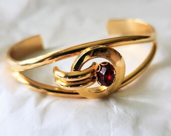 1950s Cuff Bracelet, gold tone with red rivoli jewel, cosmic style modernist jewelry, unsigned