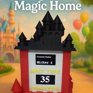 May include: A red and black 3D printed replica of a Disney castle with a digital display that reads "Wait Time 35 Minutes". The display also shows "Hollywood Studios Mickey &" above the wait time. The castle is set against a blurred background of a cartoon castle and a blue sky.