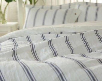 Set di 3 lenzuola in puro lino stone washed, a righe bianche e blu, copripiumino + 2 federe.