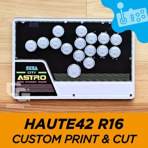 May include: A white and black arcade control panel with the text "SEGA CITY ASTRO AERO DYNAMIC SHAPE" and "POWER CONTROL SYSTEM". The panel has 16 round buttons and a black background.