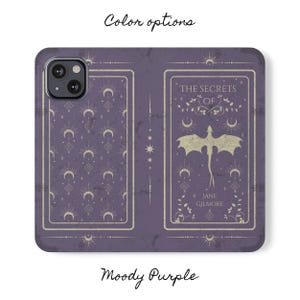 May include: A purple phone case with a distressed look. The case features a design with a dragon and the text "The Secrets of Jane Gilmore".