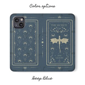 May include: A deep blue phone case with a white design featuring a dragon and the text "The Secrets of Jane Gilmore".