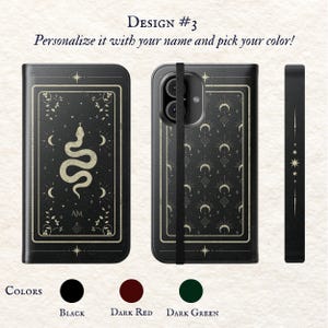 May include: A black phone case with a gold snake design and a black strap. The case features a pattern of moons and stars. The text "AM" is on the case. The case is available in black, dark red, and dark green.