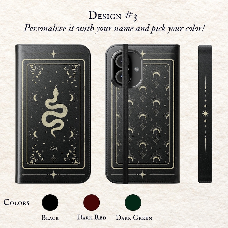 May include: A black phone case with a gold snake design and a black strap. The case features a pattern of moons and stars. The text "AM" is on the case. The case is available in black, dark red, and dark green.