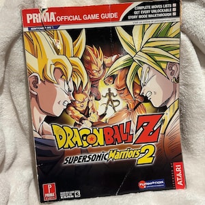 Könnte beinhalten: Ein offizielles Prima Game Guide für Dragon Ball Z: Supersonic Warriors 2. Das Cover zeigt Illustrationen von Charakteren aus dem Spiel in leuchtenden Farben. Der Guide enthält vollständige Bewegungslisten und Story-Modus-Walkthroughs. Lizenziert von Atari.