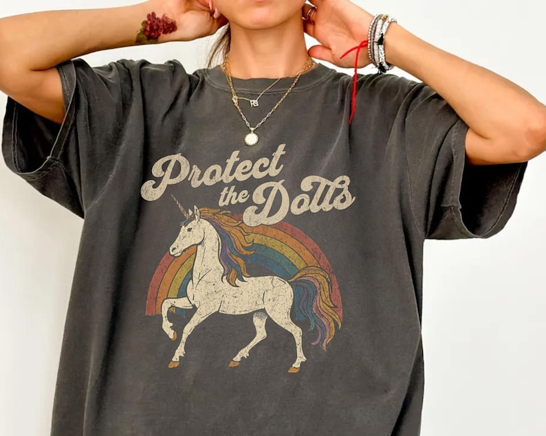 Protect the Dolls Shirt, Trans Rights T-Shirt, LGBTQ Pride Unicorn Tee, Pedro Pascal Inspired Queer Protest Shirt Anti-Trump Democrat Gift Pepper