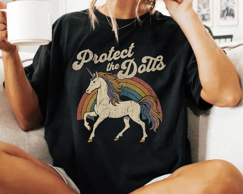 Protect the Dolls Shirt, Trans Rights T-Shirt, LGBTQ Pride Unicorn Tee, Pedro Pascal Inspired Queer Protest Shirt Anti-Trump Democrat Gift Black