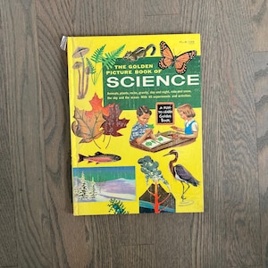 May include: A yellow book titled "The Golden Picture Book of Science" with illustrations of a butterfly, a fish, a bird, and leaves. The book cover also includes the text "A Fun To Learn Golden Book."