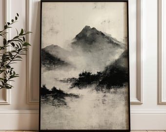Puede incluir: Una impresión artística enmarcada que presenta un paisaje montañoso monocromático. La obra de arte representa una cordillera brumosa con picos oscuros y texturizados sobre un fondo claro y neutro. El marco negro complementa la estética.