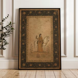 May include: A framed rectangular wall art print featuring a sepia-toned illustration of a person in traditional attire standing beside a white horse while holding a bird. The artwork is enclosed by a dark, ornate floral border on a tan background.